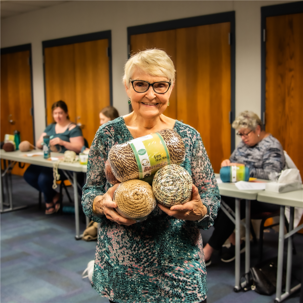  Instructor holding yarn